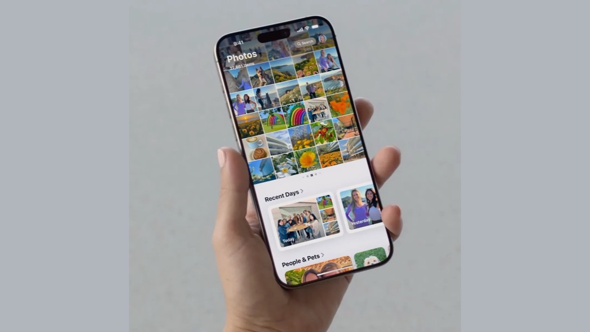 An iPhone showing the Photos app library grid — the Hidden album lives inside this library and syncs to iCloud.