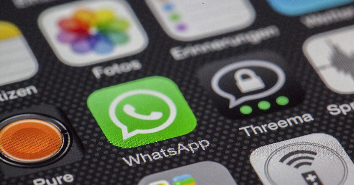 Detailed macro of smartphone screen showcasing popular app icons like WhatsApp.