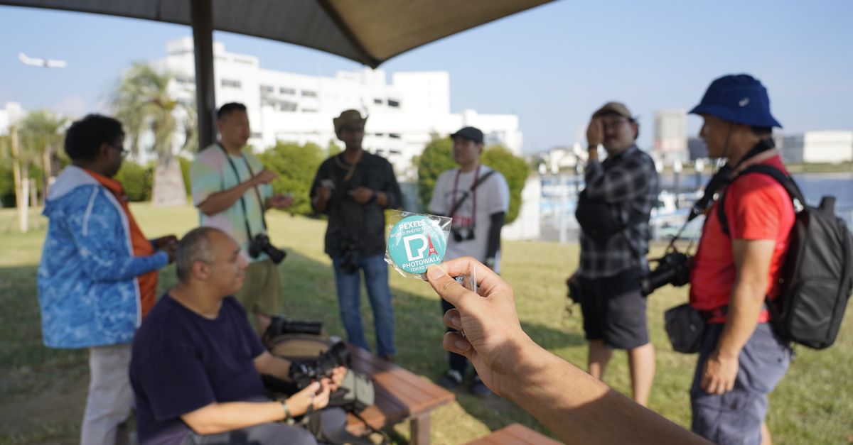 Photographers meet outdoors in Ota City, Tokyo, capturing moments together.