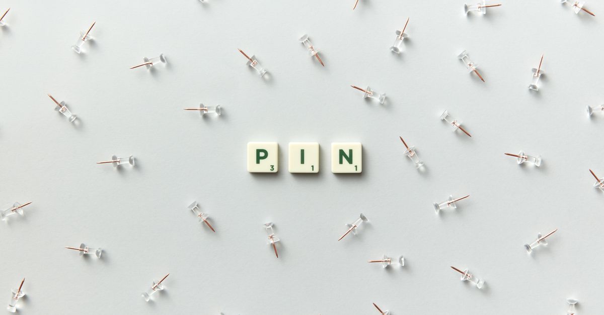 Minimalist arrangement of push pins and scrabble letters spelling 'PIN' on a white background.